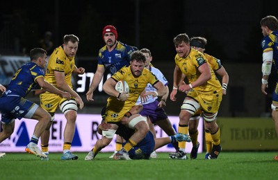 240426 - Zebre Parma v Dragons RFC - United Rugby Championship - Thomas Young of Dragons is tackled