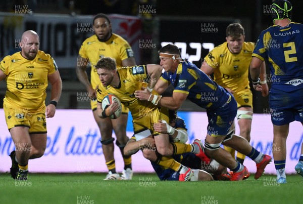 240426 - Zebre Parma v Dragons RFC - United Rugby Championship - Angus O’Brien of Dragons is tackled