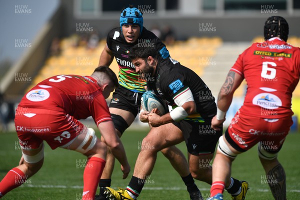 260322 - Zebre Parma v Scarlets - United Rugby Championship - Paolo Buonfiglio of Zebre is tackled by Liam Mitchell of Scarlets