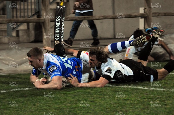 010315 - Zebre v Dragons- Dragons Geraint Rhys Jones scores try despite tackle by  Mirko Bergamasco