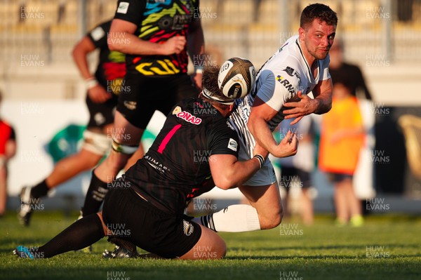 210418 - Zebre v Ospreys - Guinness PRO14 -  Joe Thomas of Ospreys offloads the ball as he is tackled by Andrea Lovotti of Zebre