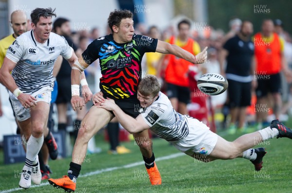 210418 - Zebre v Ospreys - Guinness PRO14 -  Matteo Minozzi of Zebre offloads the ball as he is tackled