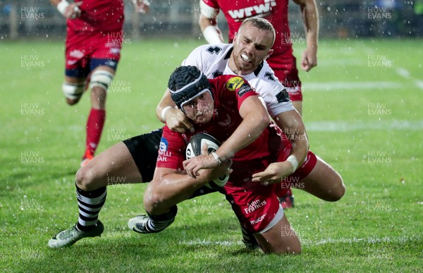 090917 - Zebre Rugby Club v Scarlets - Guinness PRO14 -  Ryan Elias of Scarlets is tackled by Ciaran Gaffney of Zebre