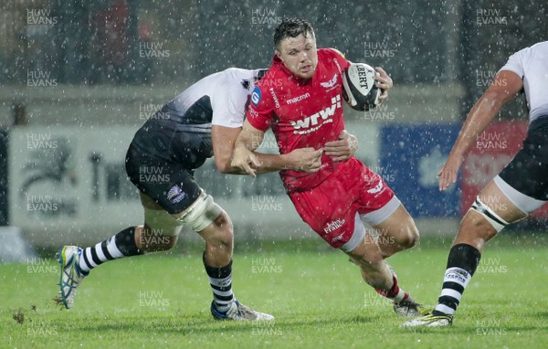 090917 - Zebre Rugby Club v Scarlets - Guinness PRO14 -  Steffan Evans of Scarlets is tackled by Tommaso Castello of Zebre