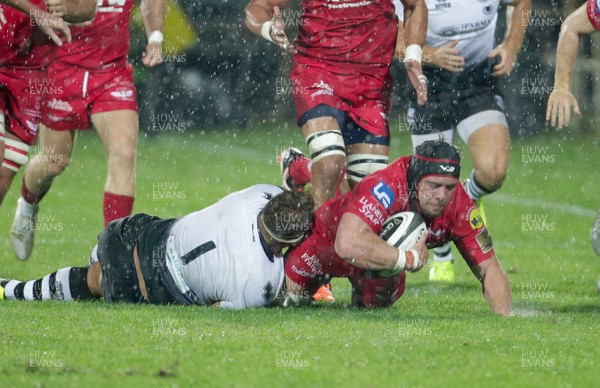 090917 - Zebre Rugby Club v Scarlets - Guinness PRO14 -  Will Boyde of Scarlets is tackled by Andrea Lovotti of Zebre 